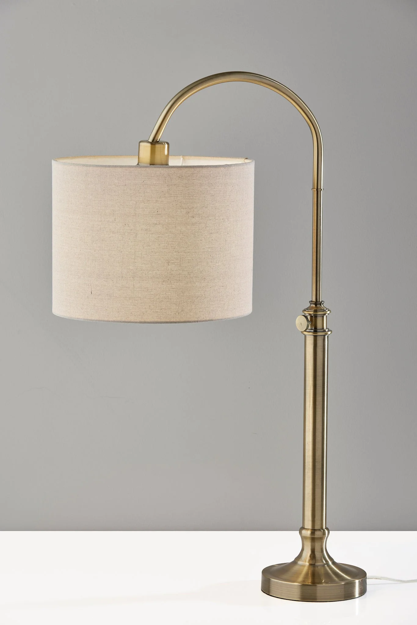 Antiqued Brass Metal Adjustable Arched Lamp With Beige Drum Shade By Homeroots - Image 4