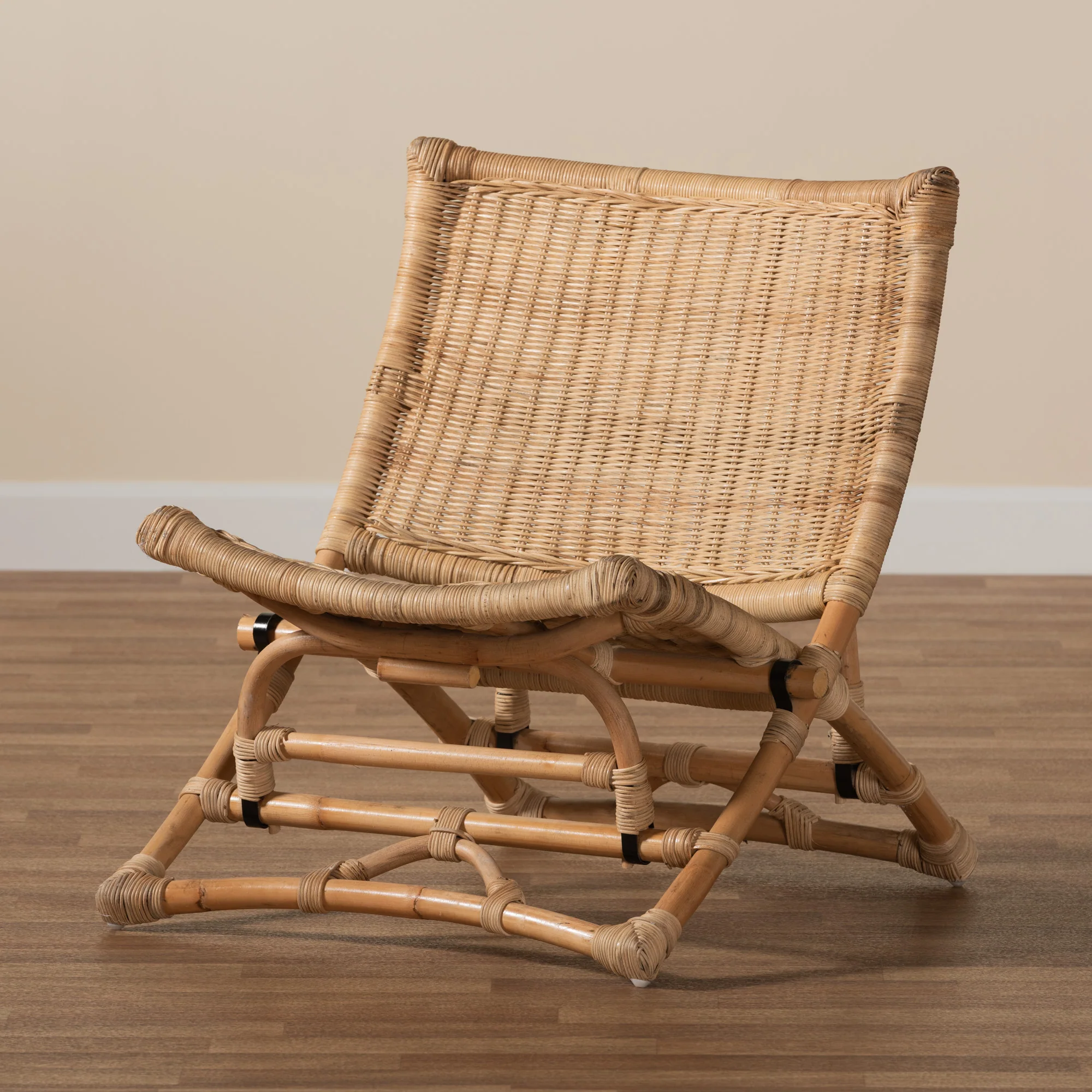 Baxton Studio bali & pari Herrara Modern Bohemian Natural Brown Antique Rattan Foldable Lounge Chair - Image 9
