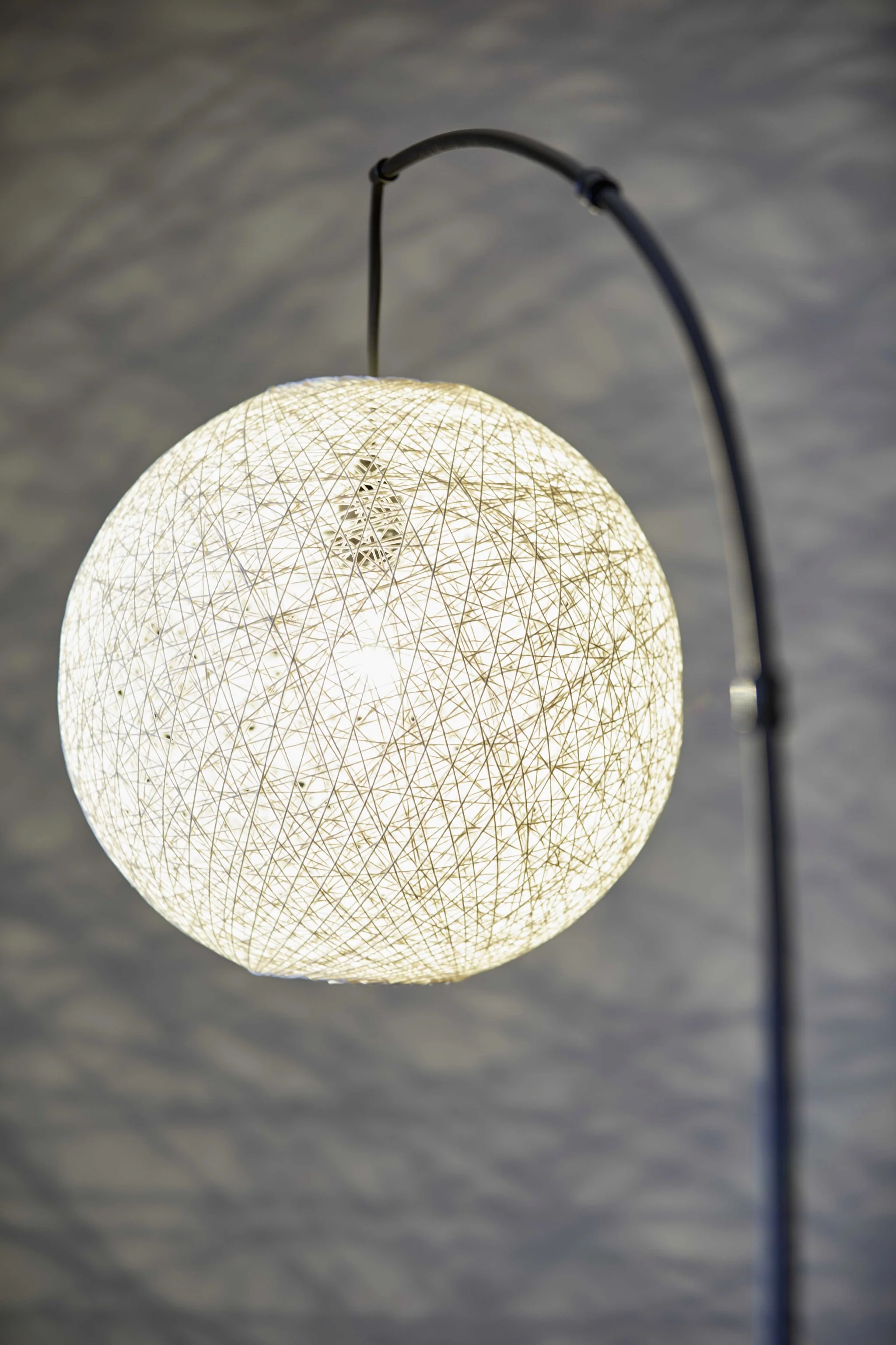 Floor Lamp with Bronze Metal Arc and Groovy Rattan String Ball Shade By Homeroots - Image 3